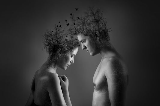 A couple in nature engaged in a psychospiritual healing journey, reconnecting through mindful presence and relationship therapy